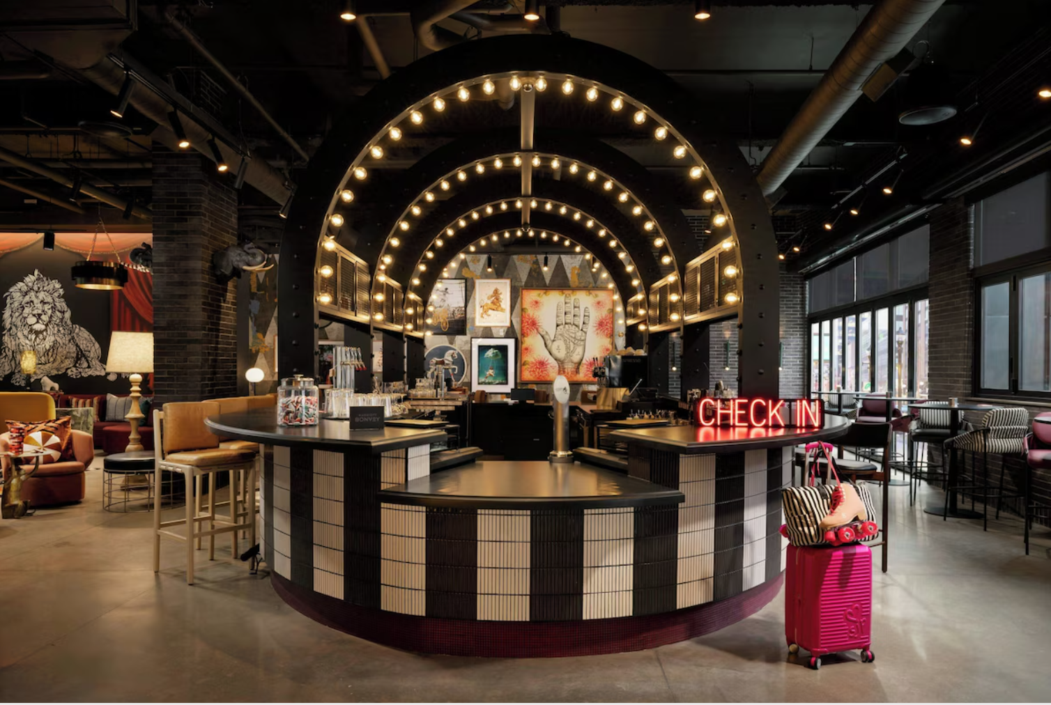 Moxy Allentown lobby with neon CHECK IN sign and eclectic design
